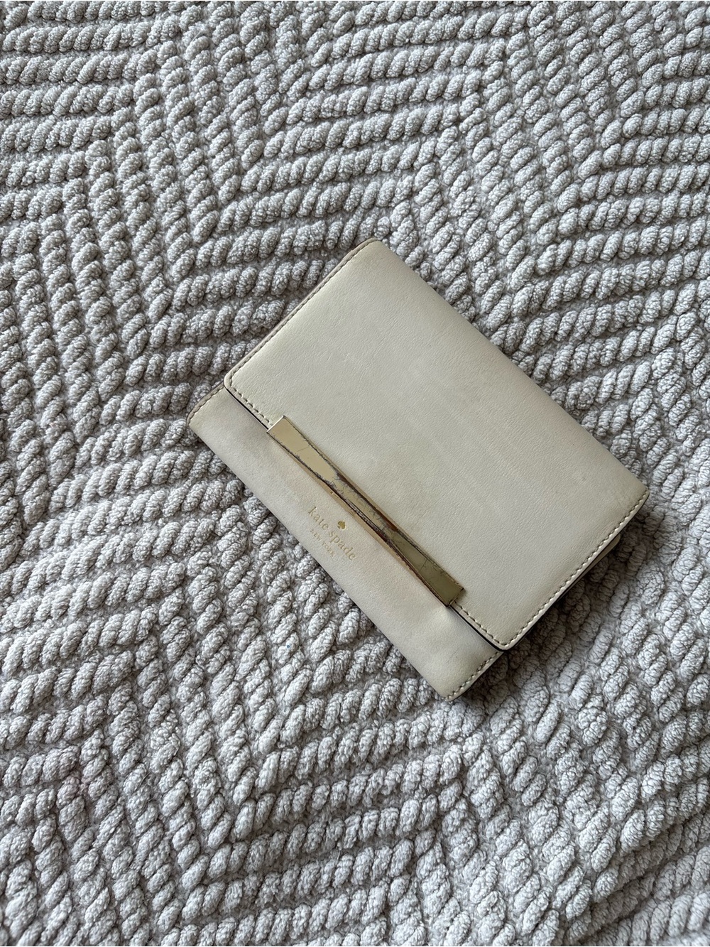kate spade cream leather bifold wallet with gold bar detail